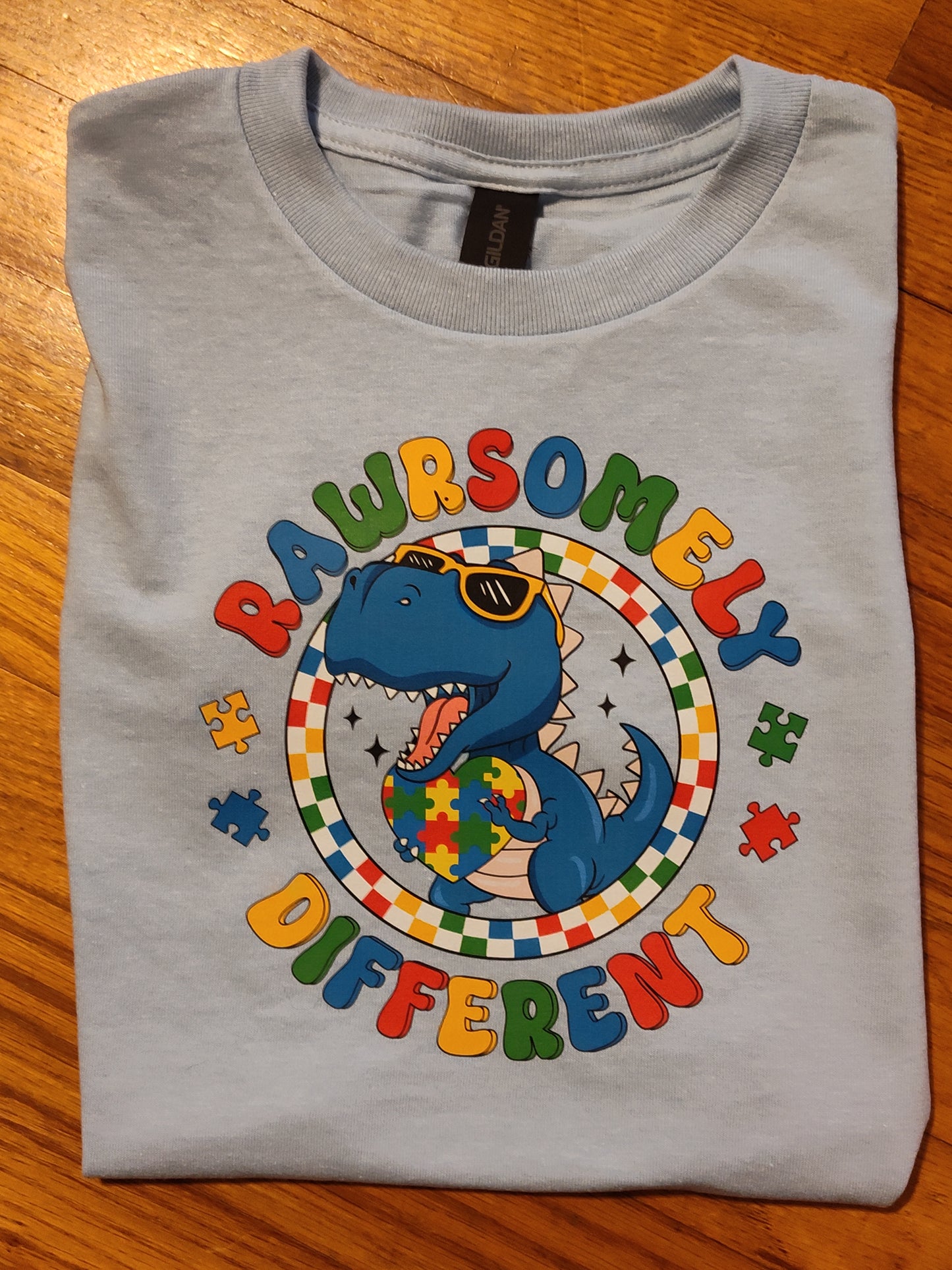 Kids/youth Rawrsomely different Autism tshirt